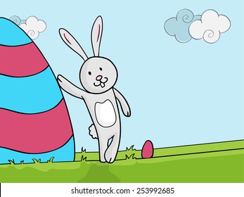 Happy Easter celebration with cute bunny standing near a colorful big egg on nature background.