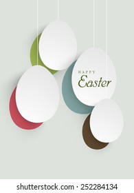 Happy Easter celebration with shiny hanging eggs.