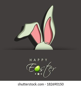 Happy Easter celebrations greeting card design with bunny ears on grey background and stylish text. 