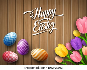 Happy Easter colorful egg with tulips flower beautifully above wooden brown background