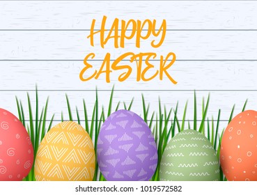 Happy Easter. Easter colorful eggs in row with different simple ornaments. white wooden background and grass frame.