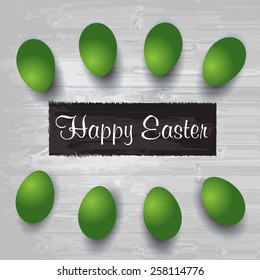 Happy Easter. Easter eggs on the wooden table. Wood background. Vector EPS 10
