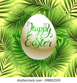 Happy easter. Festive Easter egg with letting on a background of green leaves