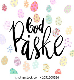 Happy Easter God Paske danish hand written brush lettering with decorated eggs on white background.