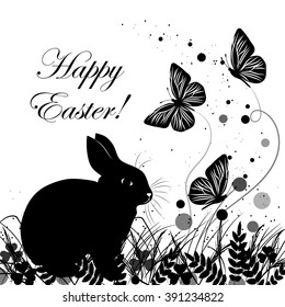 Happy Easter. Greeting card in black and white style. Funny rabbit sitting on grass and looking at flying butterflies.