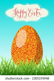 Happy Easter greeting card. Bright red and orange egg in green grass and hand drawn lettering in a frame. Vector spring illustration.