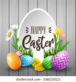 Happy Easter greeting card with colored eggs, flowers, on wood background