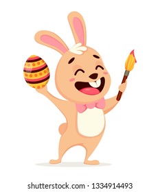 Happy Easter greeting card. Cute rabbit cartoon character holding colored egg and paint brush. Easter, spring concept. Vector illustration on white background.
