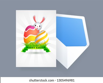Happy Easter greeting card design with illustration of cute rabbit and easter eggs on rays background.
