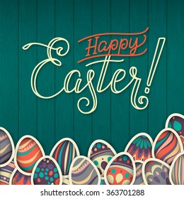 Happy easter Greeting Card. On the dark green wooden background calligraphy. Congratulations on the holiday. A lot of Easter eggs.