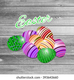 Happy easter Greeting Card. On the dark green wooden background calligraphy. Congratulations on the holiday. A lot of Easter eggs.