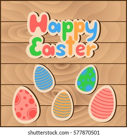Happy Easter greeting card, poster .The text and colored eggs on the background of wooden boards. Vector illustration.