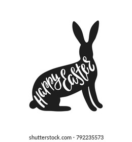 Happy Easter greeting card with silhouette of bunny. Handwritten vector lettering text. Calligraphic phrase. Holiday design.

