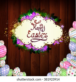 Happy Easter greeting on a wooden background with gold glitter 