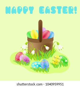 Happy Easter greeting with painted eggs and wicker basket in the green grass and spring flowers
