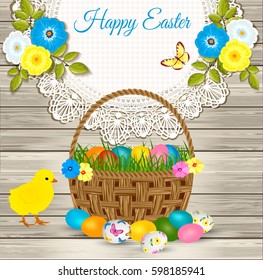 Happy Easter greetings - easter basket with eggs, yellow chicken on wooden background.