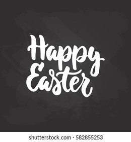 Happy easter - hand drawn lettering phrase isolated on the black chalkboard background. Fun brush ink inscription for photo overlays, greeting card or t-shirt print, poster design