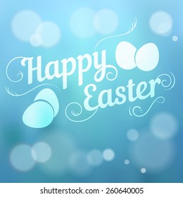 Happy Easter hand drown text. Typographical blurred background. 