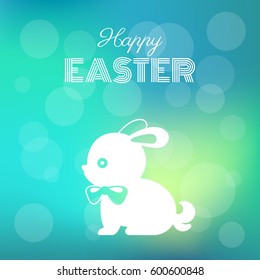 happy easter headline with silhouette bunny on bokeh background