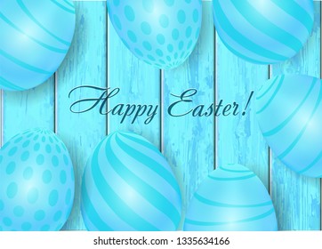 Happy Easter holiday composition with Easter eggs  on blue wooden background.