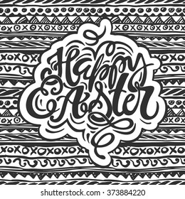 Happy Easter inspirational quote handwritten with black ink and brush, custom lettering for posters, t-shirts and cards. Vector calligraphy on pink watercolor strokes background.