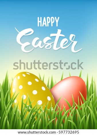 Happy Easter Lettering card whith decorated gold and red eggs at fresh green grass on blue sky background