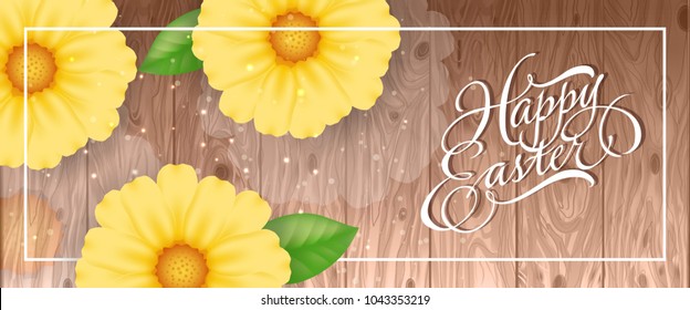 Happy Easter lettering in frame with yellow flowers and glittering on wooden background. Calligraphic inscription can be used for greeting cards, festive design, postcards, banners