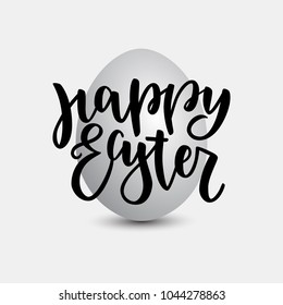 Happy Easter lettering for greeting card on grey natural egg background. Vector illustration isolated on grey background. Modern black brush ink handlettering