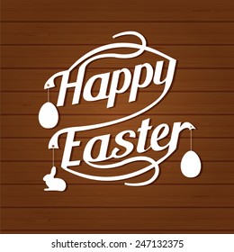 Happy easter lettering. White  letters text  on dark brown wood background