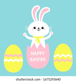 Happy Easter painted eggs. Rabbit bunny holding paw print hands up. Yellow scarf. Cute cartoon kawaii funny baby character. White farm animal. Blue background. Isolated Flat design Vector illustration