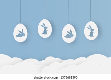 Happy easter. Paper cut with bunny shaped in eggs that looks cute on blue sky background. Vector illustration. Greeting card, invitation, posters and wallpaper