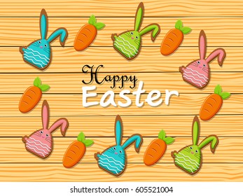 Happy Easter rabbit carrots shape cookies on brown wooden background