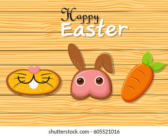 Happy Easter rabbit carrots shape cookies on brown wooden background