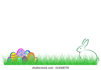 Happy Easter. Rabbit and colorful eggs in the green grass