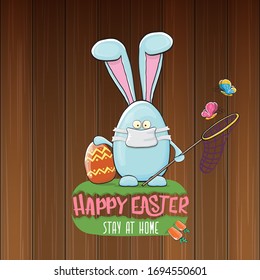 Happy easter stay at home greeting card with funny cartoon blue rabbit with medical face mask holding butterfly net. Easter egg hunt hand drawn concept illustration banner.