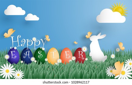 Happy Easter text with a group rainbow egg and a rabbit on grass field with butterfly and white flowers with blue sky and sun with clouds. Digital craft design in paper art style. Vector illustration.