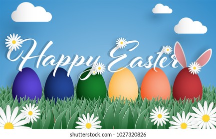 Happy Easter text with rainbow Easter eggs with rabbits ears  and white flowers on green grass field with blue sky and clouds. Digital craft design in Paper art style. Vector illustration.