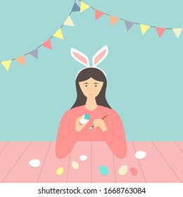Happy Easter theme. Cute girl with rabbit ears decorates eggs. Holiday illustration in flat cartoon style can be used for greeting card, poster, banner. Happy woman coloring with paints Easter eggs.
