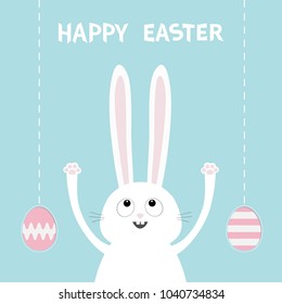 Happy Easter. White bunny rabbit head face looking up. Hand with paw print. Painting egg shell hanging. Flat design. Cute funny cartoon character Baby greeting card Blue pastel color background Vector