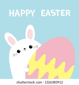 Happy Easter. White bunny rabbit holding big painted egg. Happy Easter. Funny head face, eyes, ears. Cute kawaii cartoon character. Baby greeting card. Blue background. Flat design Vector illustration