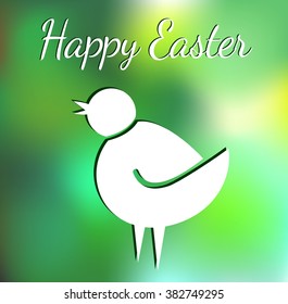 Happy Easter wishing - chick on green blurred background