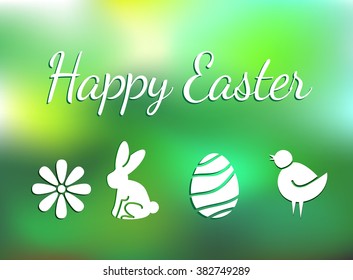 Happy Easter wishing on green blurred background