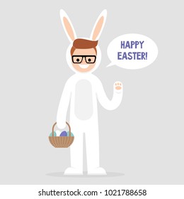 Happy easter. Young character wearing a white bunny costume and holding a basket with dyed eggs. Holidays. Flat editable vector illustration, clip art. Culture and celebrations.