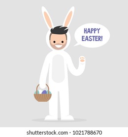 Happy easter. Young character wearing a white bunny costume and holding a basket with dyed eggs. Holidays. Flat editable vector illustration, clip art. Culture and celebrations.