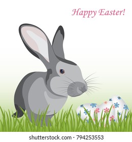 Happy Easter!Colorful, different patterned eggs and cute rabbit sitting in the green grass.Empty space for text. Isolated.Template vector greeting card with realistic eggs.Spring holiday illustration