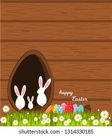 Happy Easter,Easter eggs on grass with rabbit house greeting card.