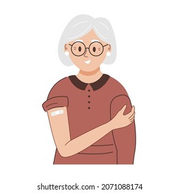 Happy elderly woman showing injection bandage after coronavirus vaccination. Smiling senior lady after safety vaccine. Cartoon flat vector illustration