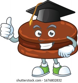 Happy face of chocolate alfajor in black graduation hat for the ceremony