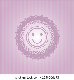 happy face icon inside badge with pink background