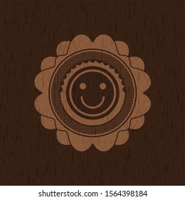 happy face icon inside badge with wood background
